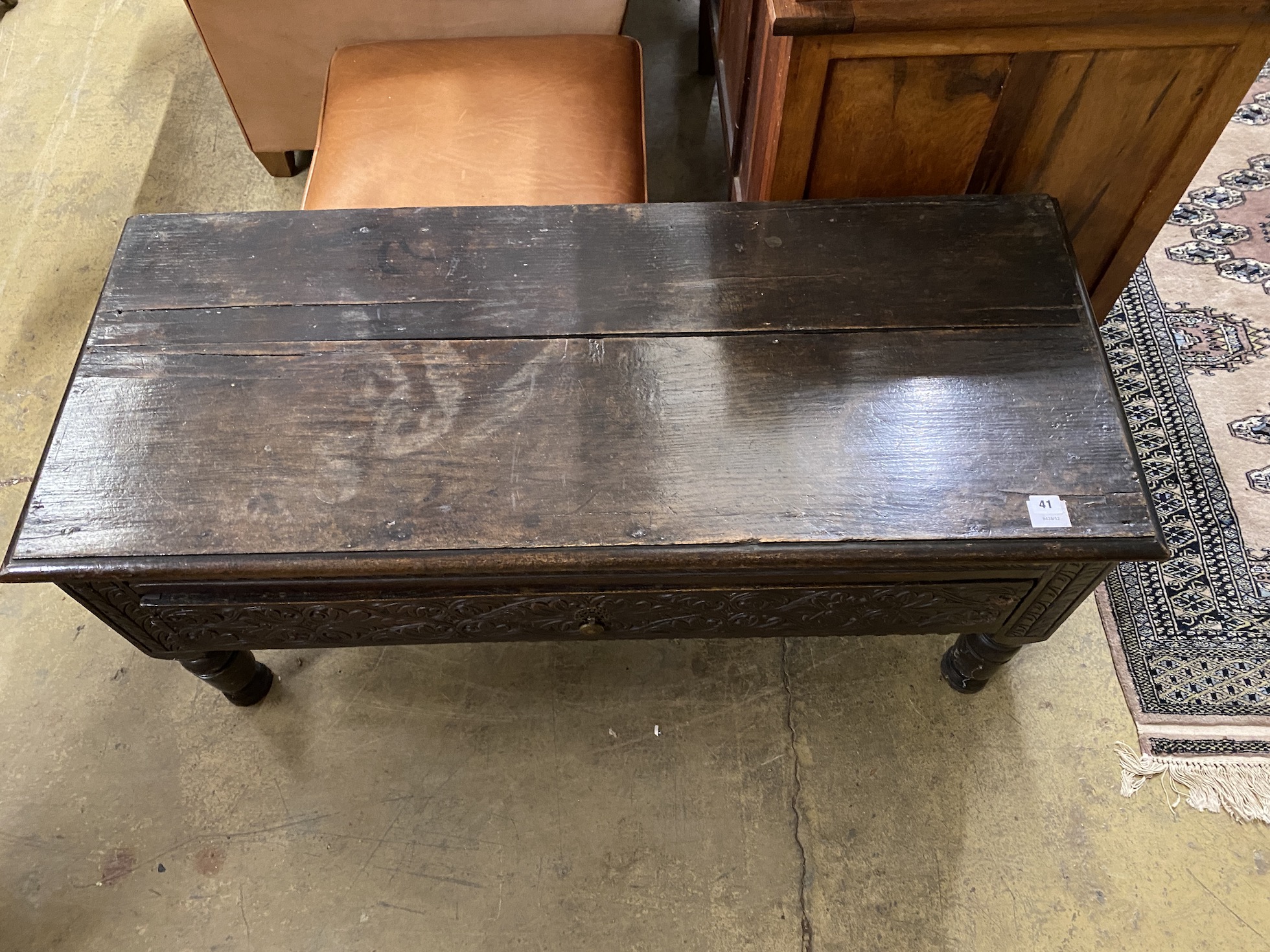 A 19th century carved oak hall bench, (adapted), width 120cm, depth 51cm, height 54cm